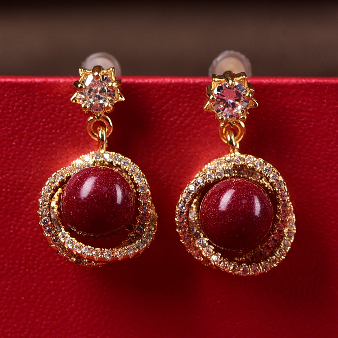 18K Gold Rotating Cinnabar Earrings - Zircon Snowflake Design